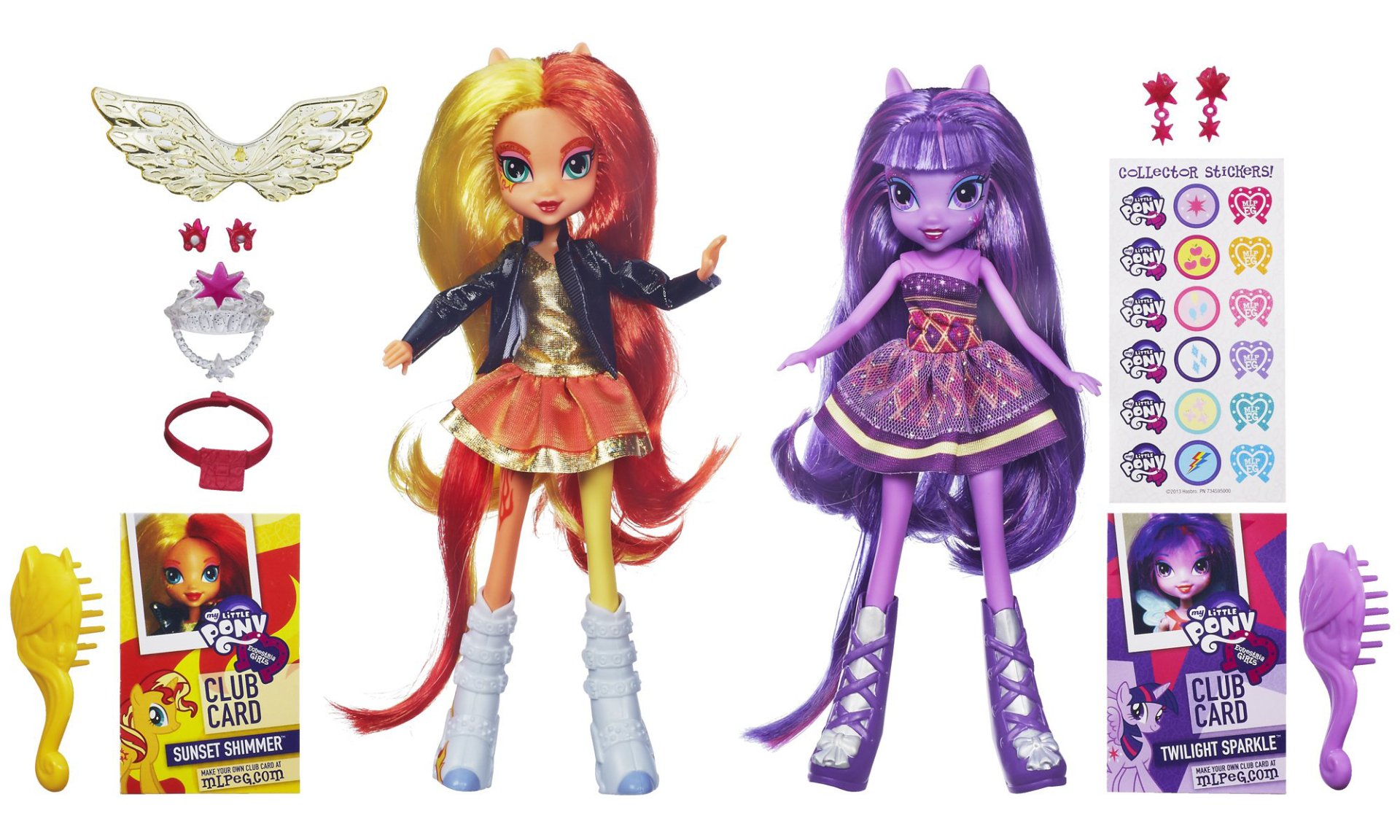 Two articulated dolls of Sunset Shimmer and Twilight Sparkle from the movie My Little Pony: Equestria Girls, accompanied by accessories like hair brushes and stickers.