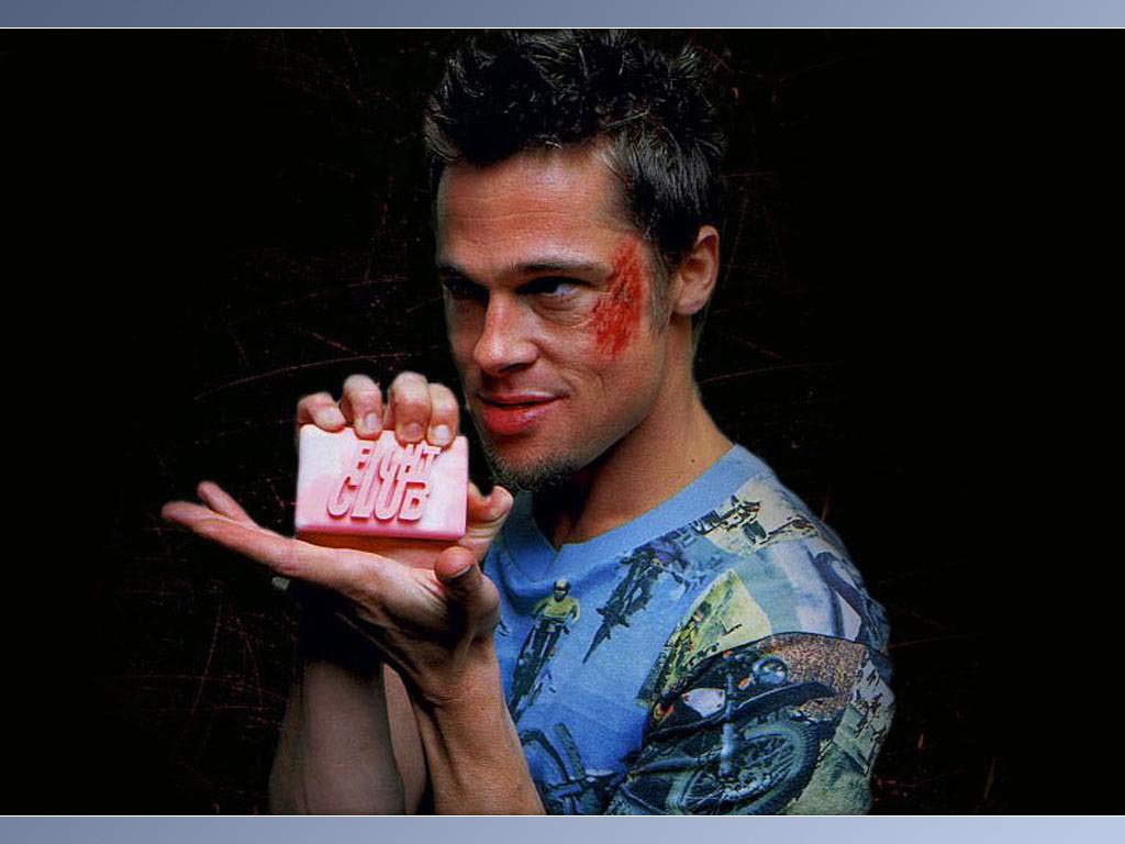 Brad Pitt as Tyler Durden in Fight Club, holding a bar of soap while sporting a bloodied face, embodies a key moment from the cult classic film.