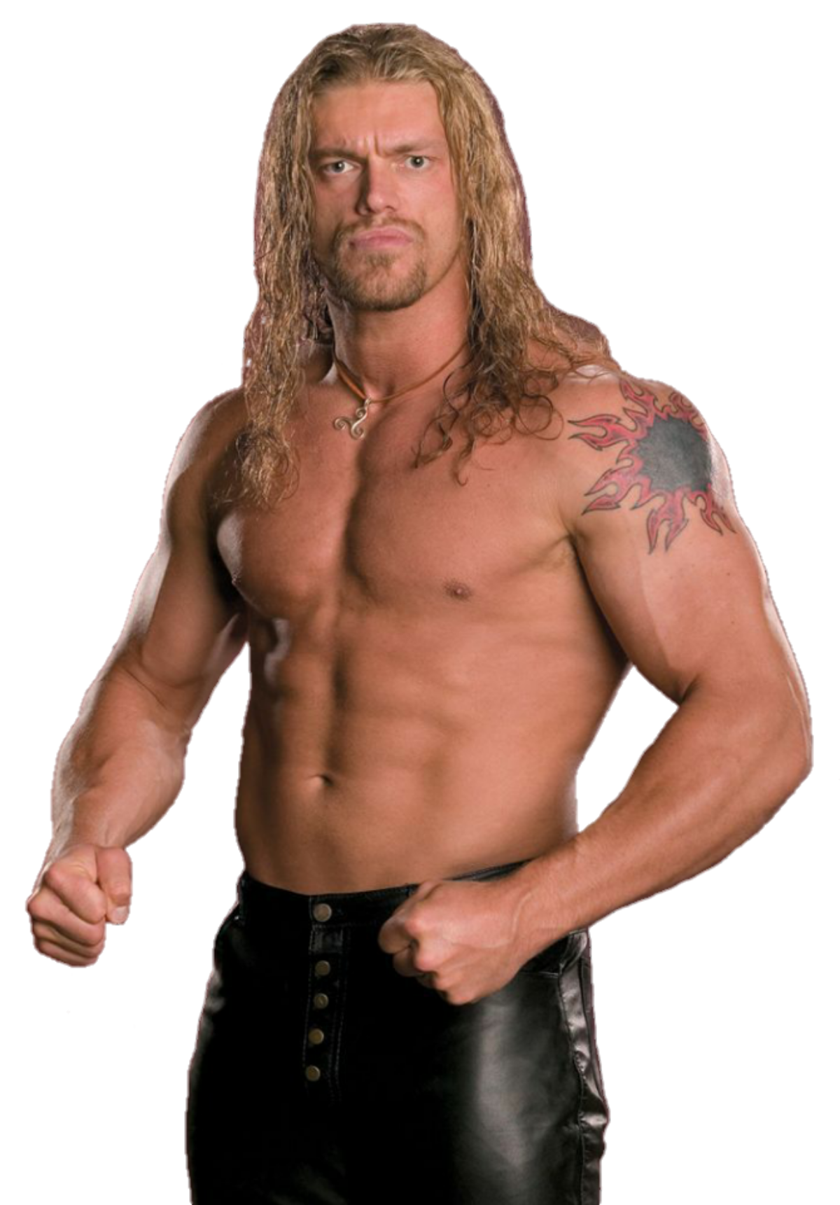 Shirtless WWE wrestler with long blond hair and a shoulder tattoo, posing with clenched fists in a sports promo-style portrait.