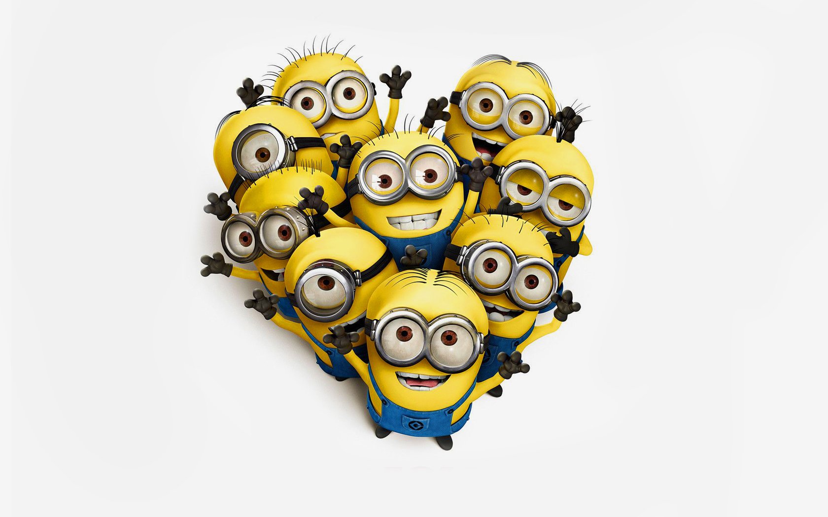 A cheerful group of yellow Minions from the movie Despicable Me forms a heart shape, smiling and waving with enthusiasm against a white background.