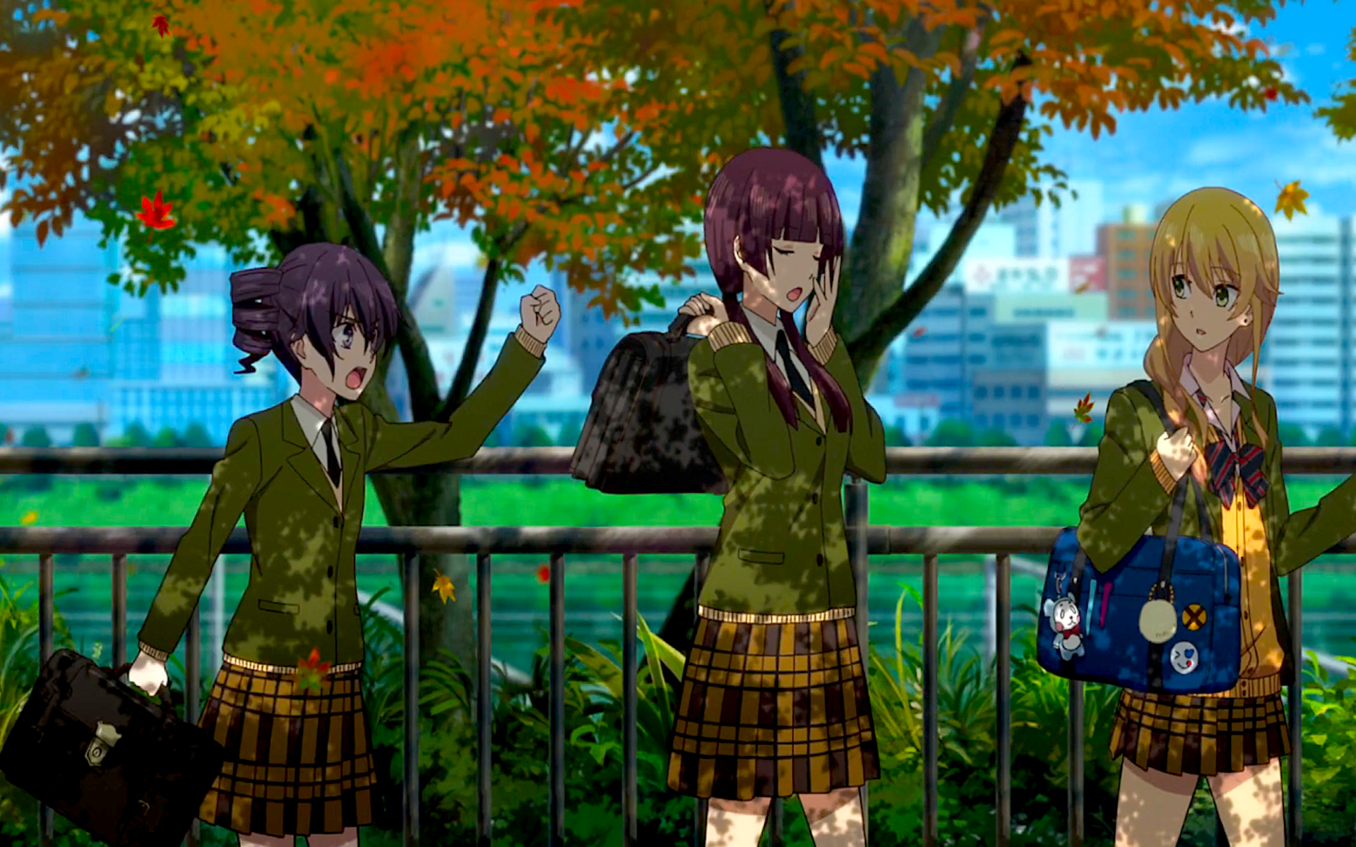 Yuzu Aihara, Harumi Taniguchi, and Himeko Momokino from the anime Citrus in green blazers and plaid skirts, chatting under autumn trees by a city waterfront.
