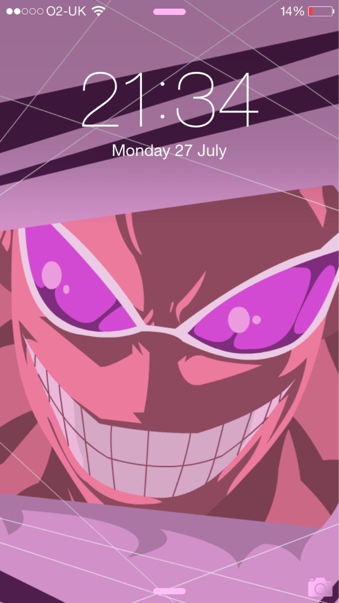 Lock screen featuring One Piece anime close-up: a menacing face with a huge toothy grin and intense purple eyes.