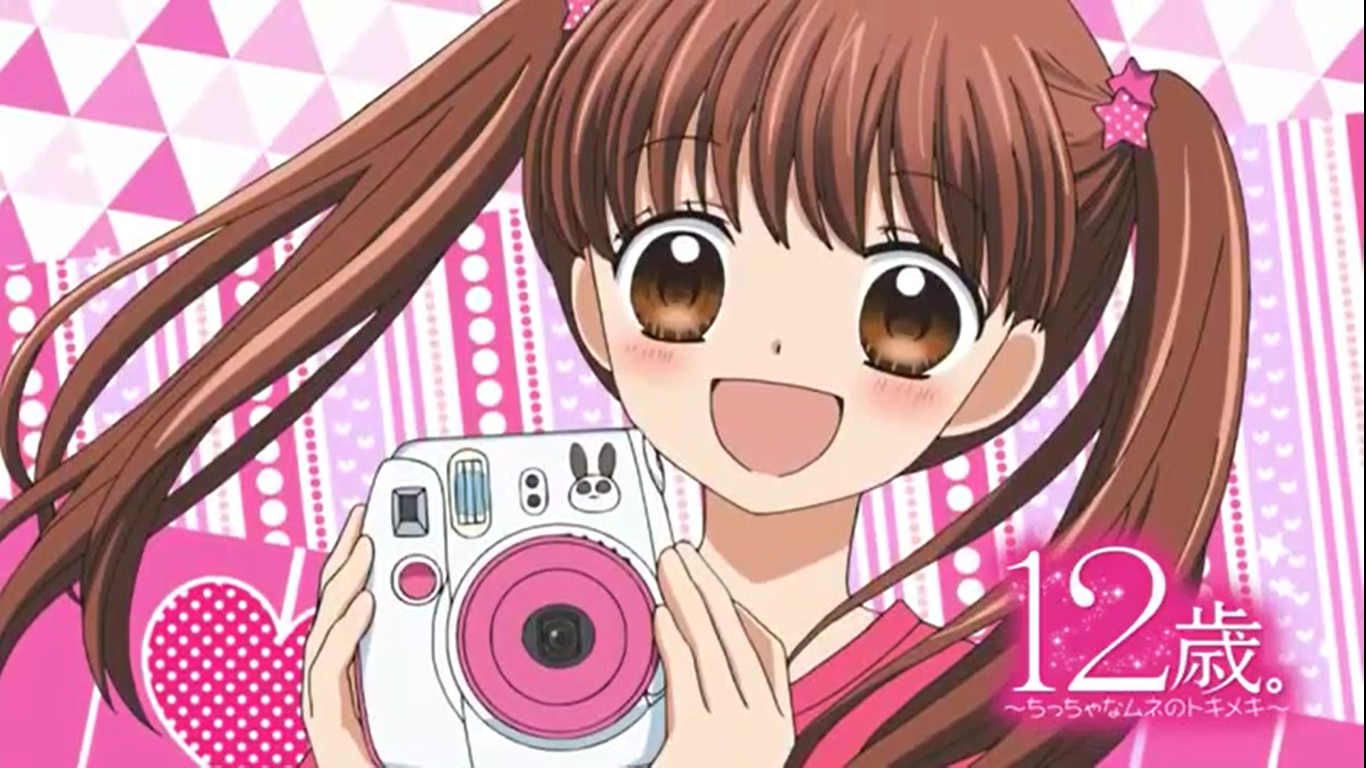 Hanabi Ayase (12-Sai) — smiling brown-haired twin-tail anime girl holding a pink instant camera against a bright pink patterned background.
