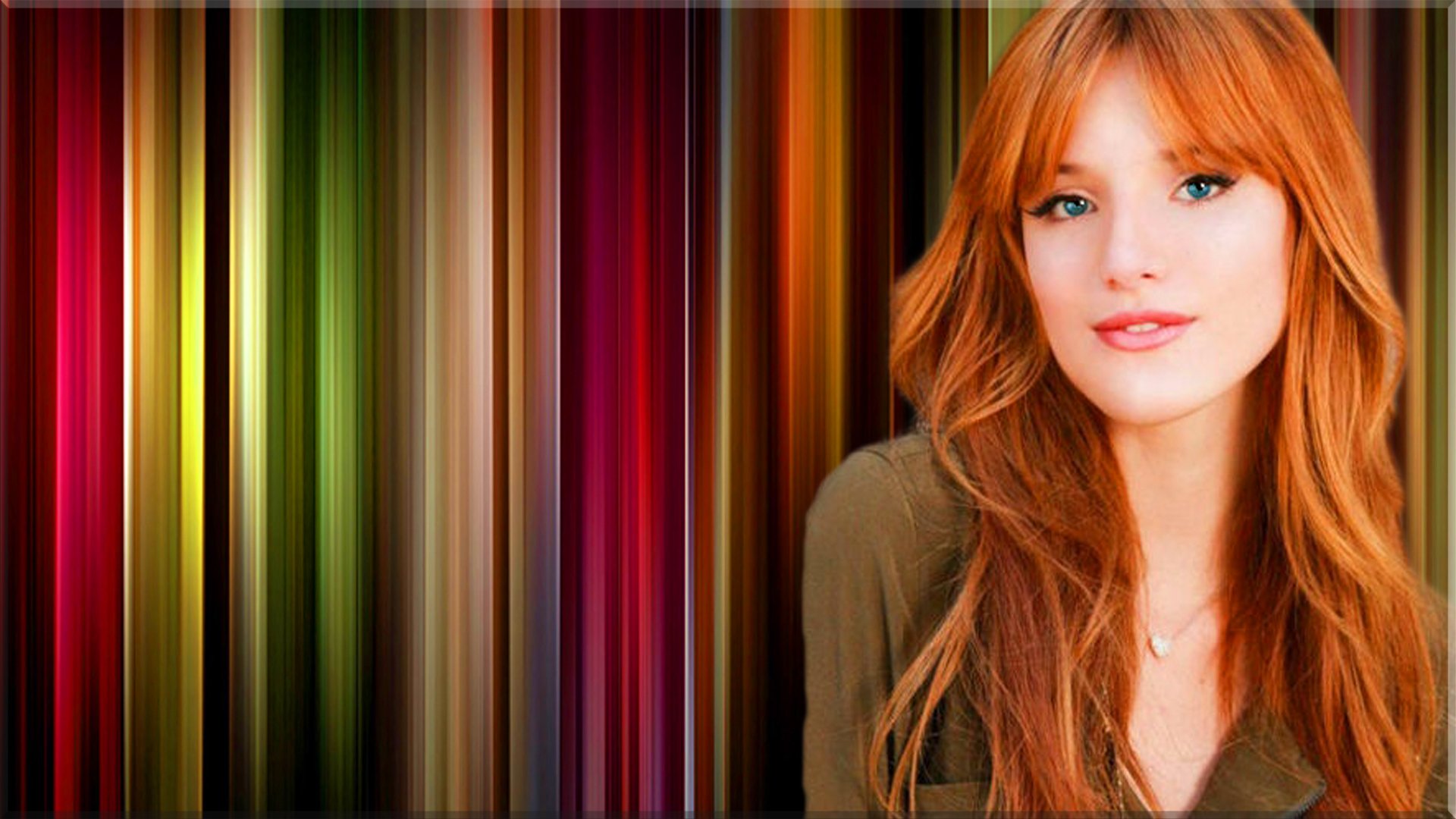 A vibrant image of redhead celebrity Bella Thorne, posing gracefully against a colorful, striped background that enhances her striking features.