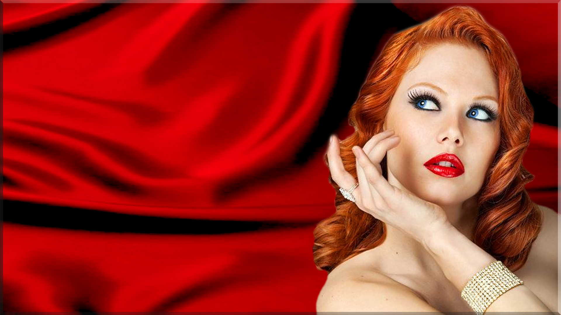 A confident redhead model poses elegantly against a backdrop of flowing red fabric, showcasing striking makeup and fashionable jewelry.