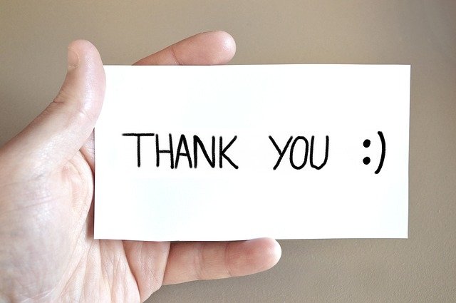  Hand holding a Thank You Card :) by athree23