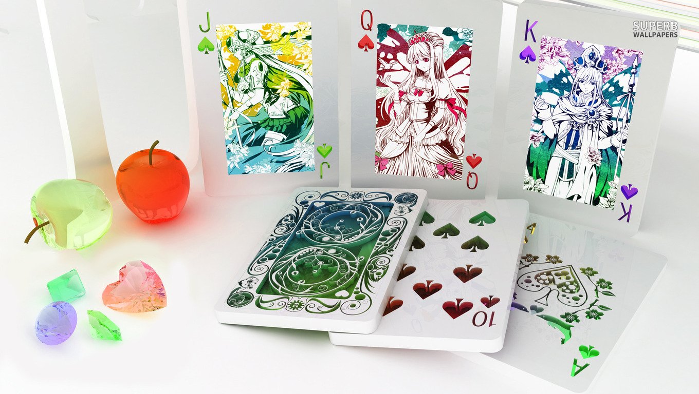 A collection of intricately designed playing cards featuring artistic illustrations of royalty, surrounded by colorful decorative elements. The scene highlights the creativity of card design.