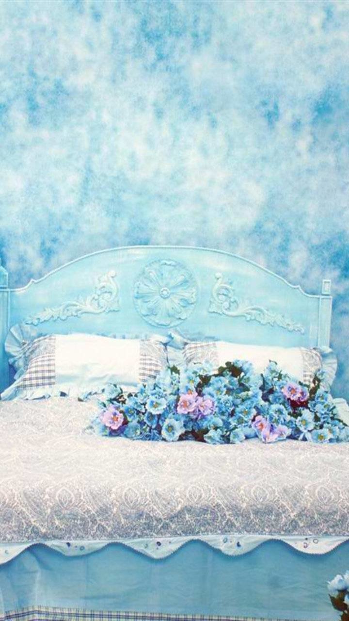  Blue and Pink Flowers on a Bed