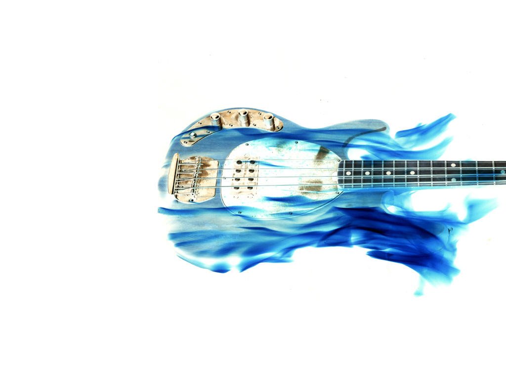A blue electric guitar appears with flowing blue waves, embodying the spirit of music and creativity. The design merges instrument and art seamlessly.