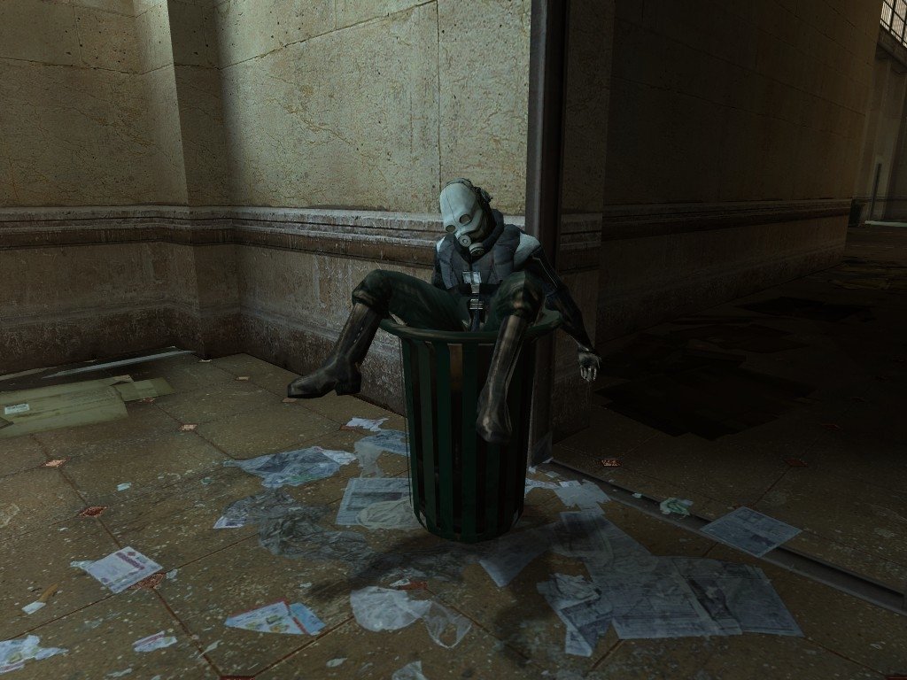 A character sits inside a trash can, surrounded by scattered papers, in a dimly lit corridor from the video game Half-Life, evoking the game's unique and immersive atmosphere.