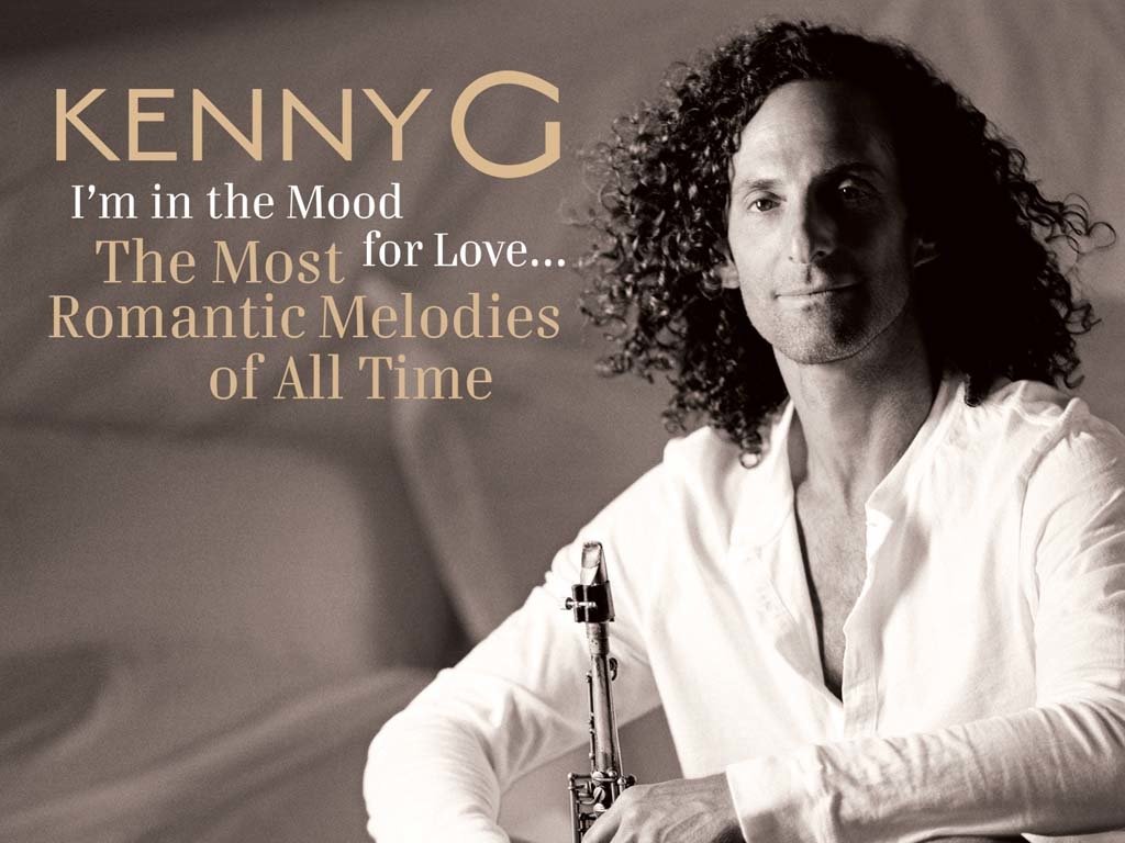 Promotional image of musician Kenny G with text highlighting his album I'm in the Mood: The Most Romantic Melodies of All Time.