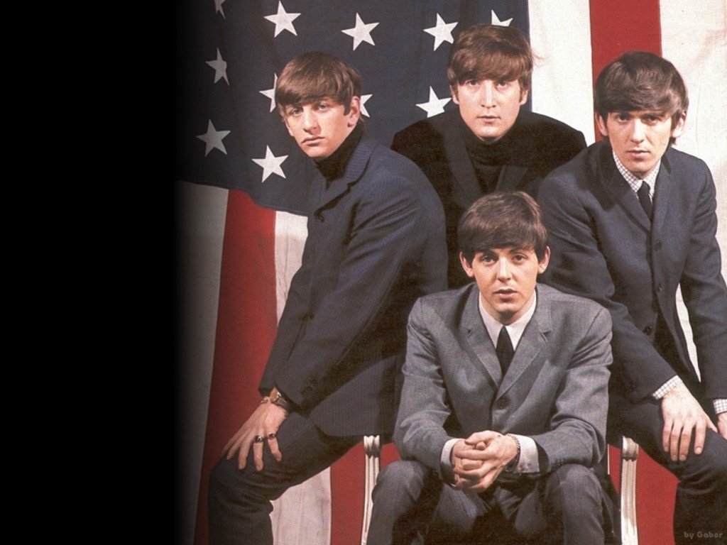 The image features The Beatles, a legendary music group, posing together in front of an American flag, exuding a stylish 1960s vibe.