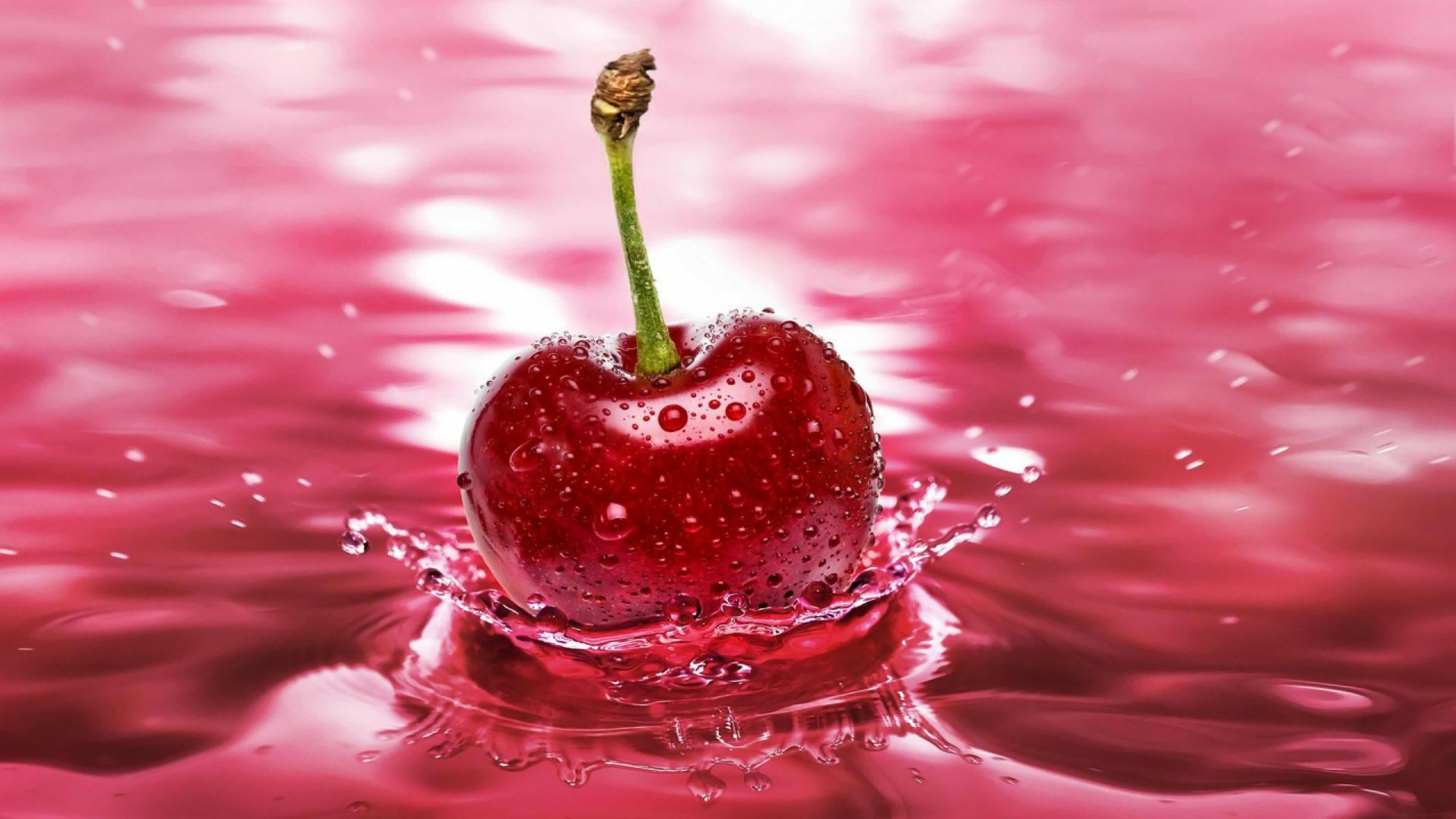Red Cherry Dropped in Water