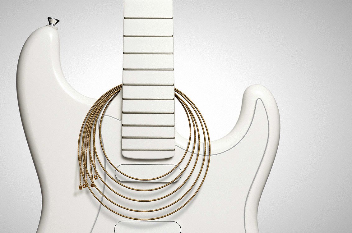 A close-up of a white guitar's neck, featuring golden strings artistically arranged around it, highlighting its sleek design and musical elegance.