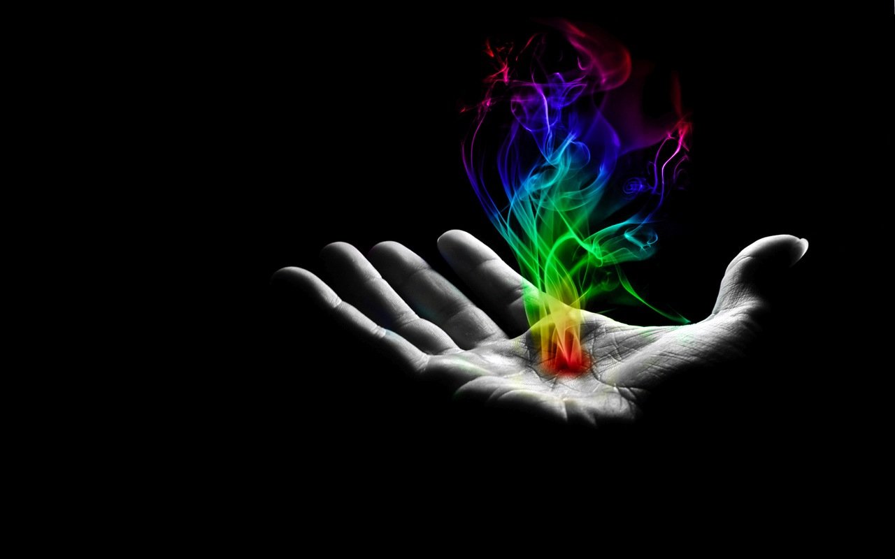 A hand emerges from a dark background, cradling vibrant, swirling colors of smoke, embodying a fusion of artistic and elemental energy.