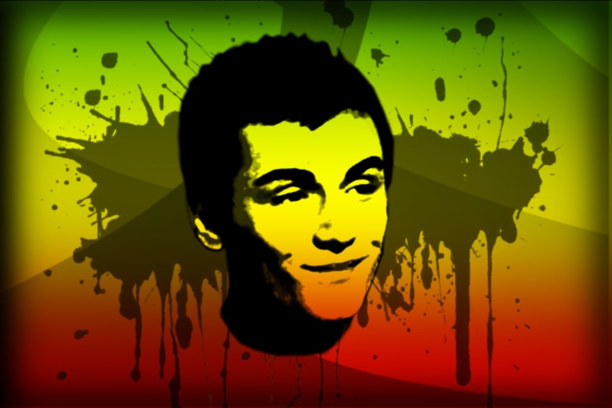 A vibrant illustration featuring a black silhouette of a young man against a colorful background, embodying the spirit of reggae music with splashes of red, yellow, and green.