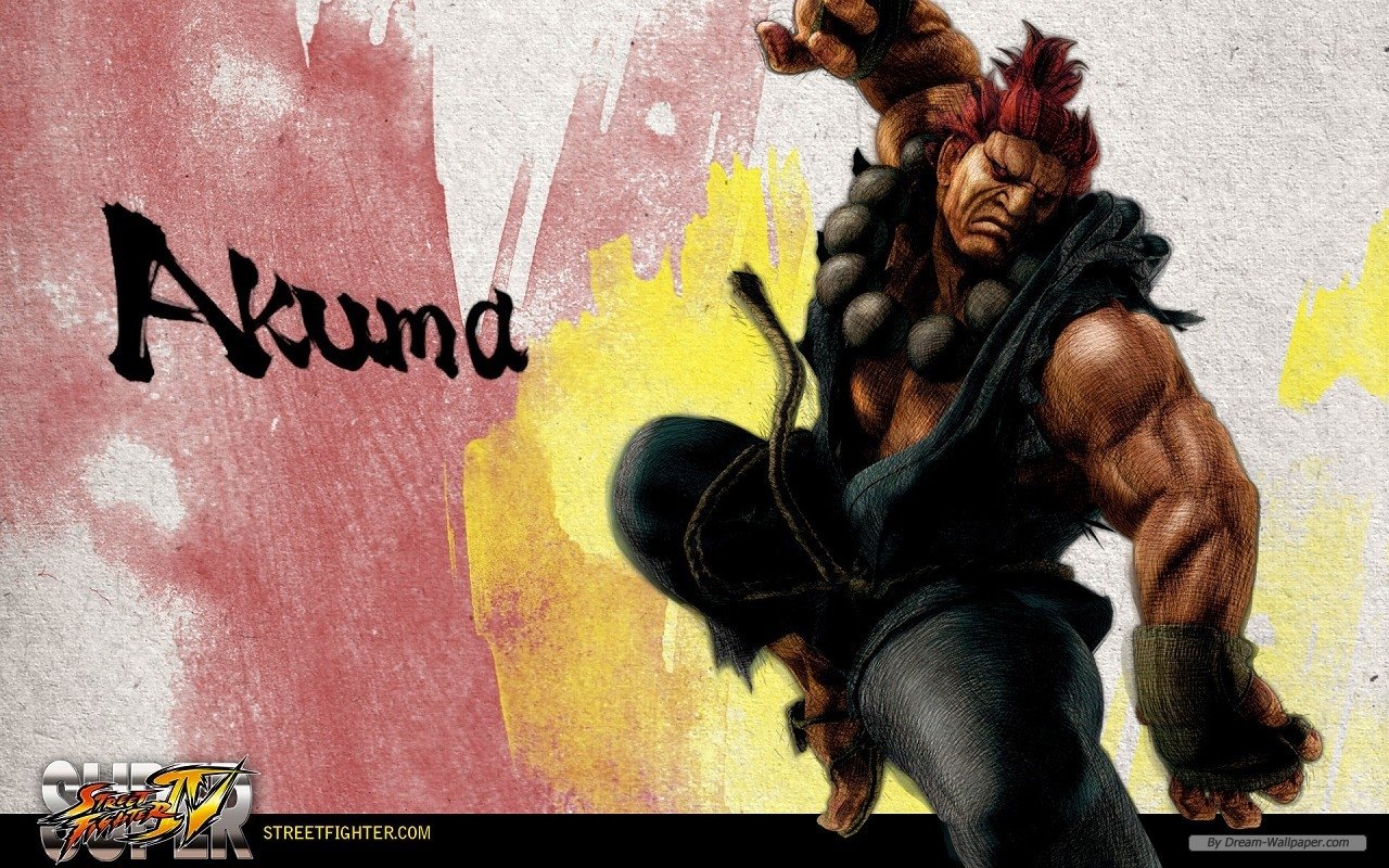 Akuma from the Street Fighter video game crouches in a fierce pose with prayer beads and clenched fist against a red-and-yellow brushstroke background, his name in stylized script.
