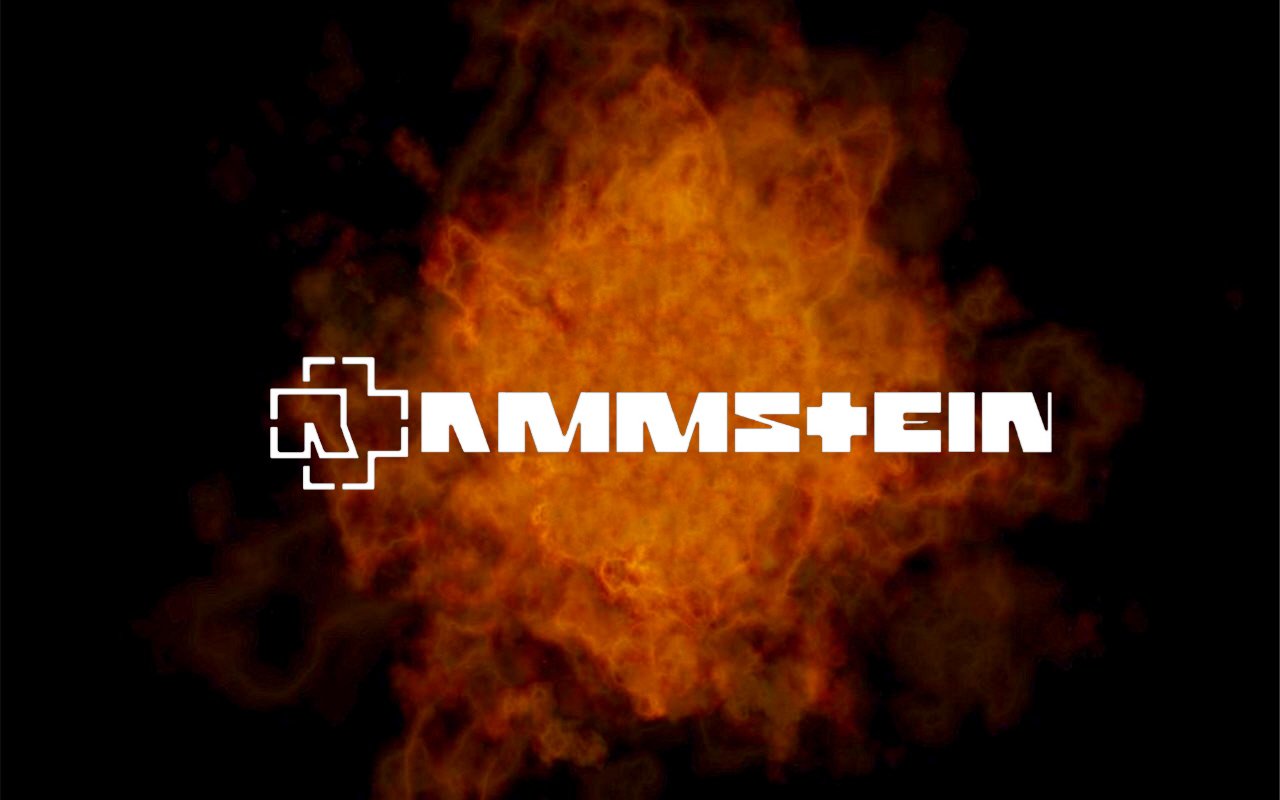 Rammstein logo in bold white text with a stylized cross, set against a fiery orange and black background representing intense music energy.