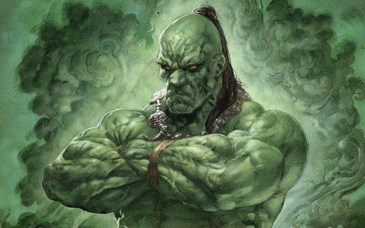 Man-made Magic: The Gathering card art of a hulking green-skinned warrior with braided topknot, crossed arms and a scowling face amid swirling emerald mist.