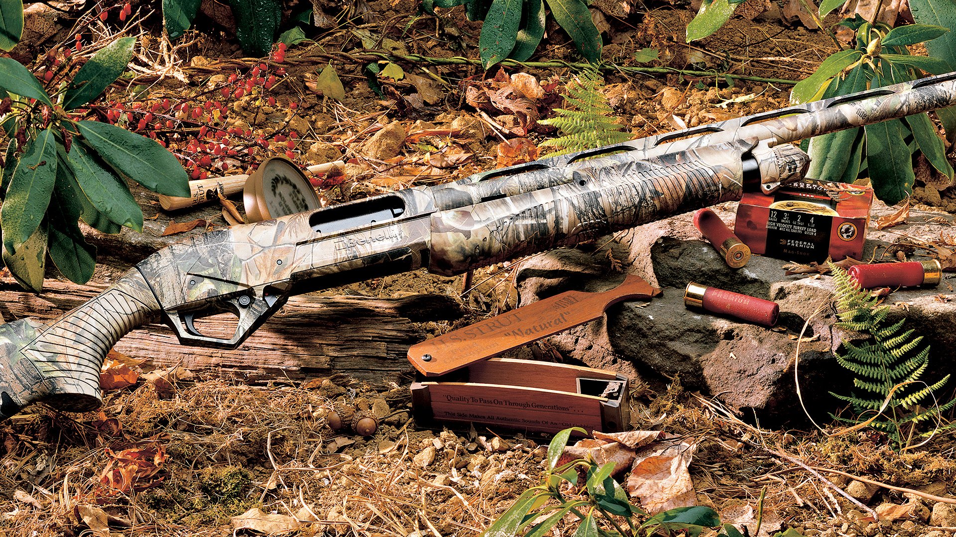 Camouflage-pattern man-made shotgun resting on a forest floor among shotgun shells, ammo boxes, and fallen leaves.