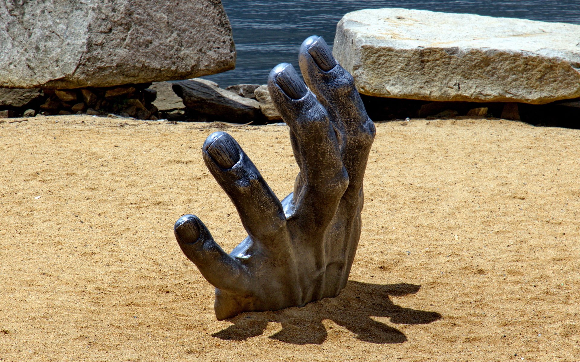  Hand in the Sand