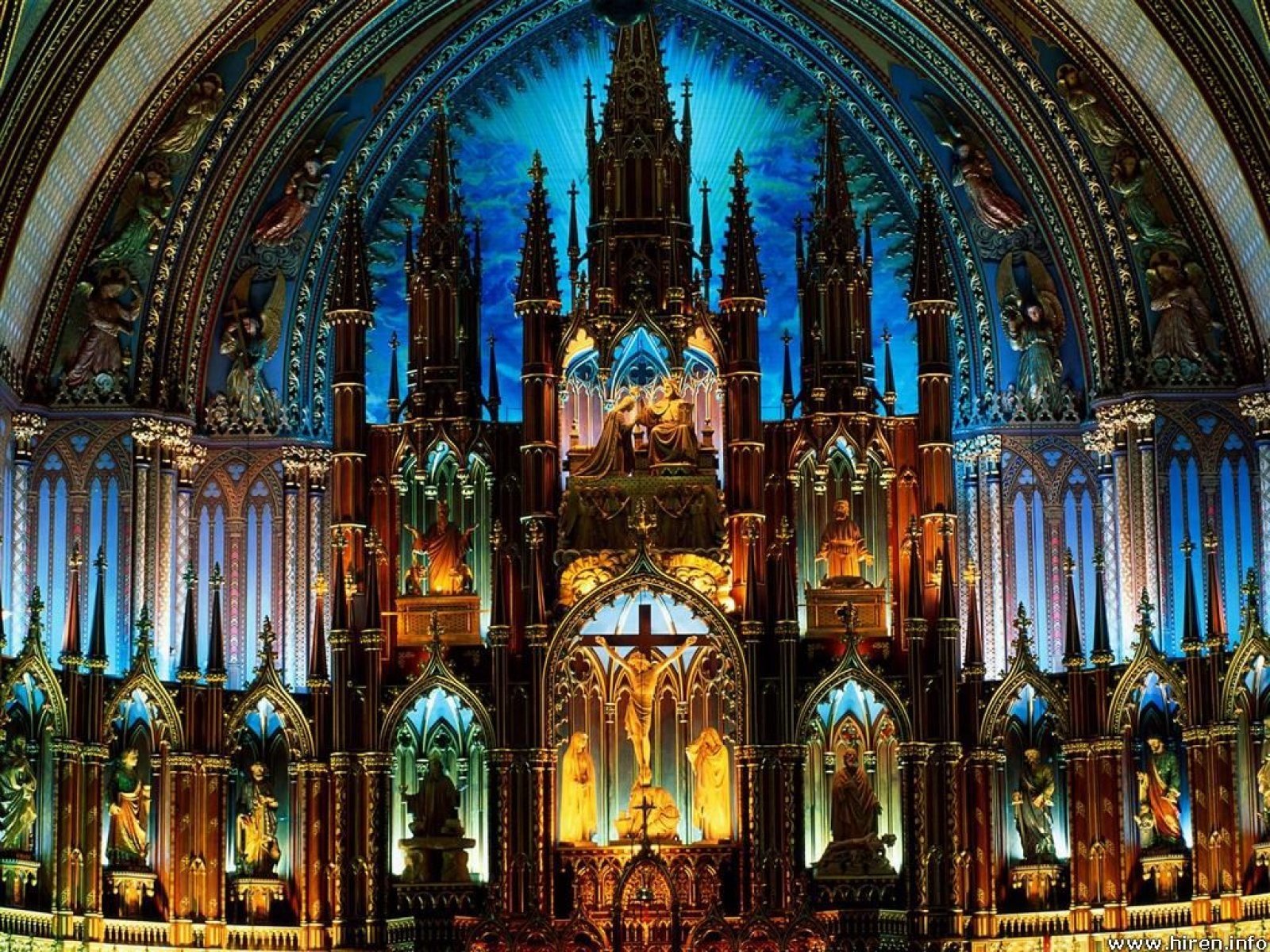 The interior of the Notre-Dame Basilica of Montreal, showcasing its stunning religious architecture, intricate woodwork, and vibrant stained glass that illuminate the space.