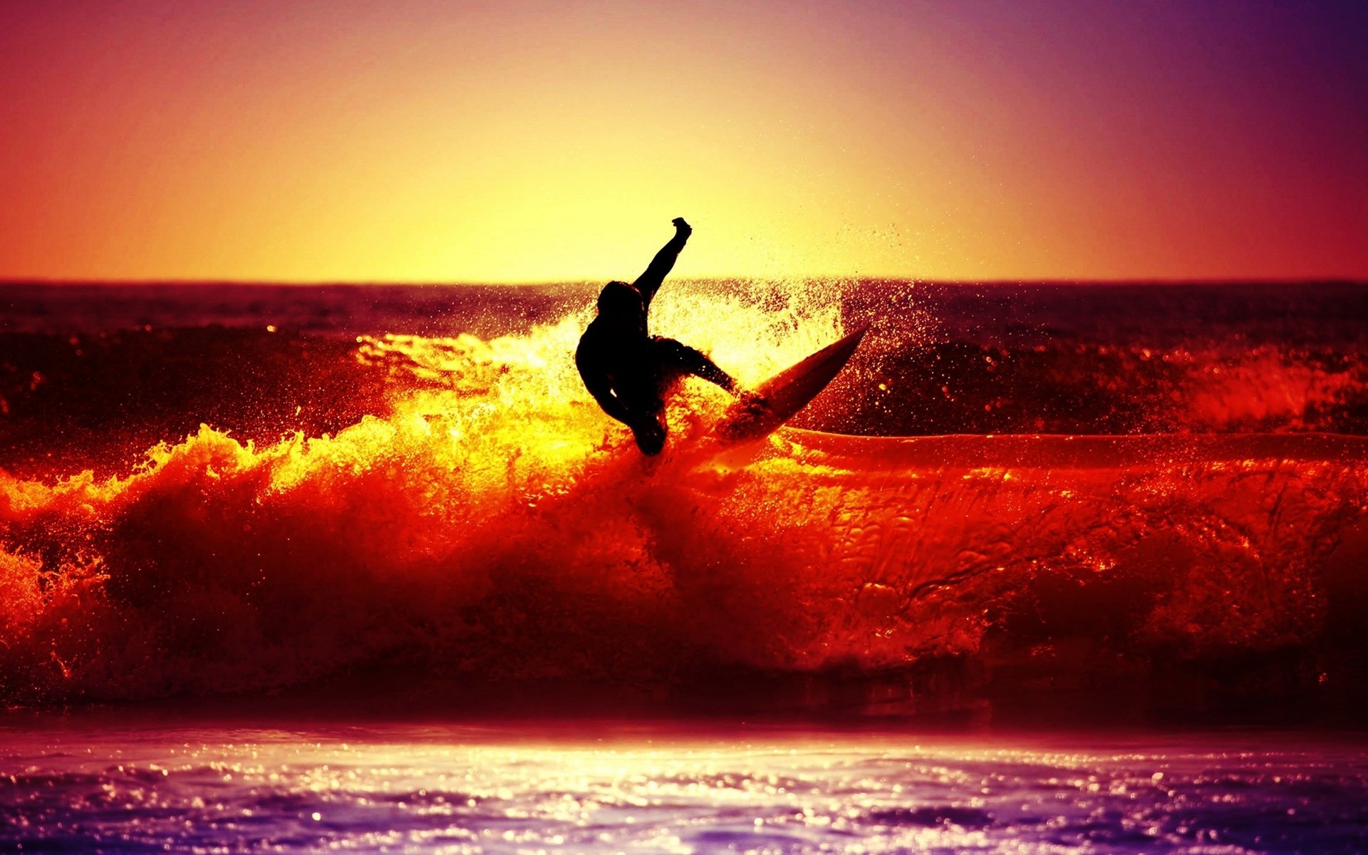 A silhouette of a surfer rides a vibrant wave at sunset, showcasing the thrill and energy of surfing as the sun casts an orange and purple glow over the ocean.