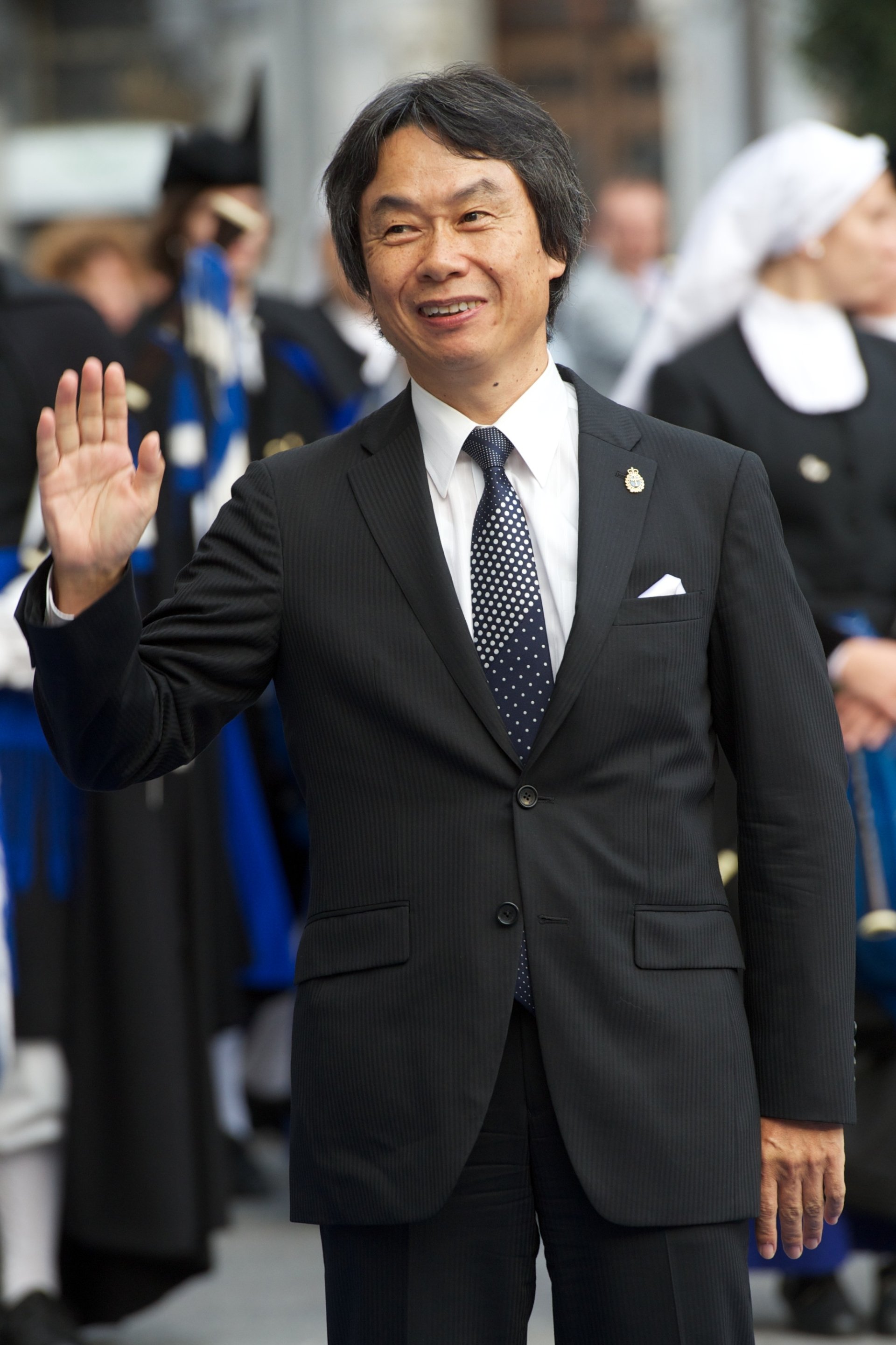man Shigeru Miyamoto character waving suit Image