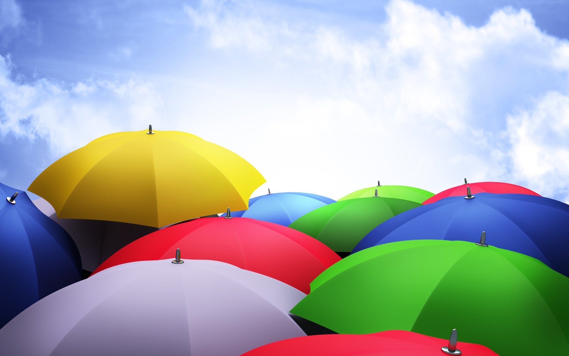 A vibrant display of colorful umbrellas against a bright sky, showcasing a variety of shades that create a lively and cheerful atmosphere.