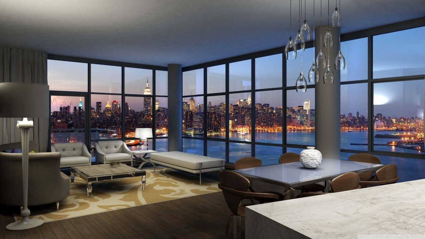 Modern man-made room featuring floor-to-ceiling windows with a cityscape view, stylish furniture, and contemporary lighting fixtures during twilight.