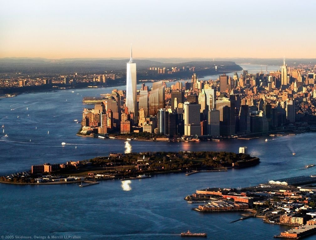 Aerial view of New York City showcasing its iconic skyline, featuring modern skyscrapers and the expansive waterfront, highlighting the city's impressive man-made landscape.