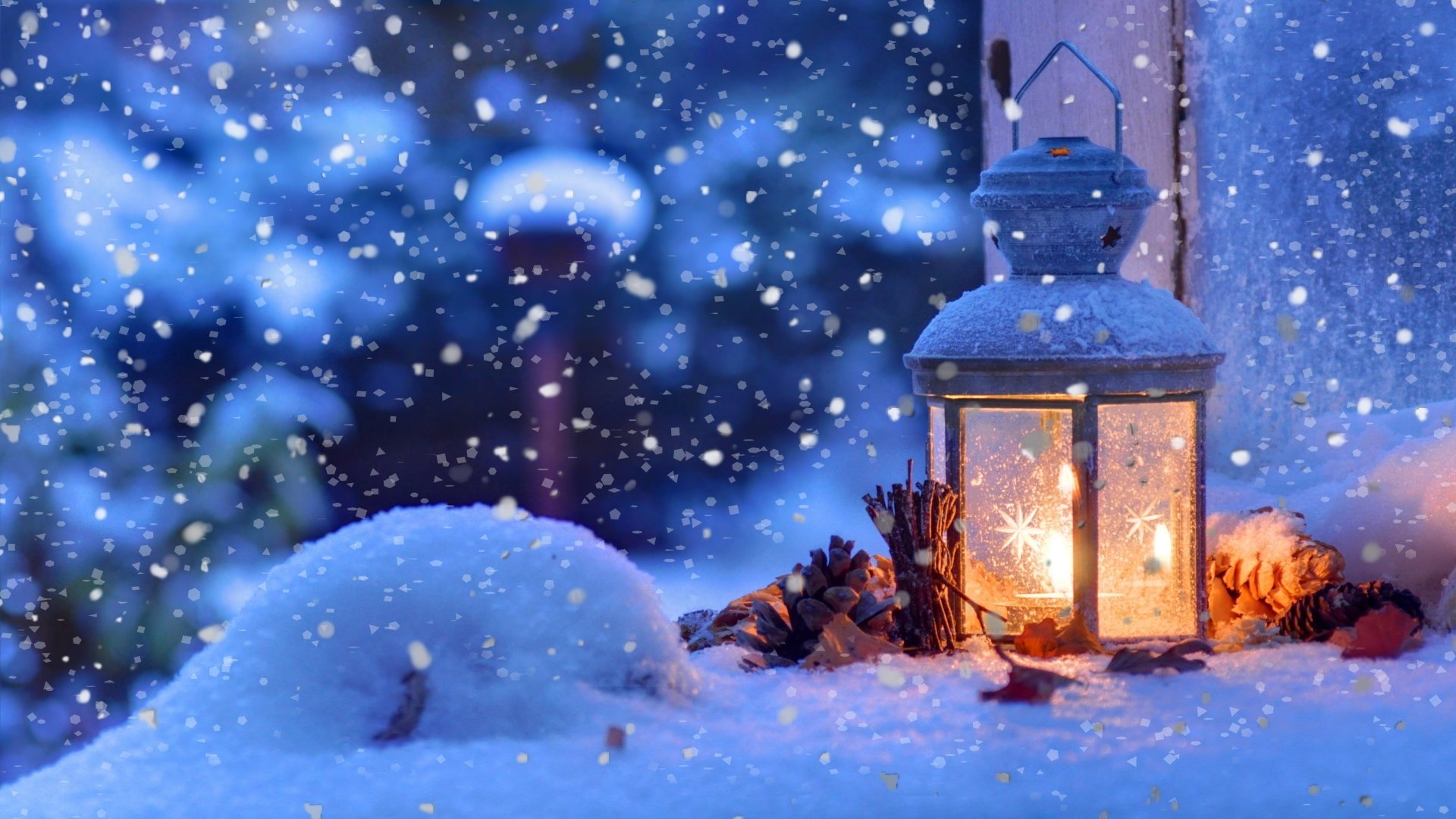 A glowing lantern surrounded by snow and pinecones, with gently falling snowflakes, evokes a cozy and magical Christmas holiday atmosphere.