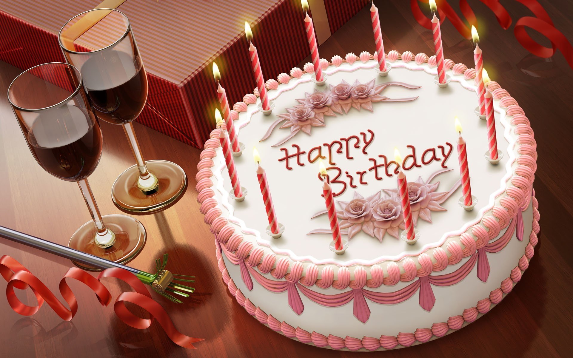 A beautifully decorated birthday cake with candles, accompanied by two glasses of red wine and festive ribbons, setting a joyful holiday atmosphere.