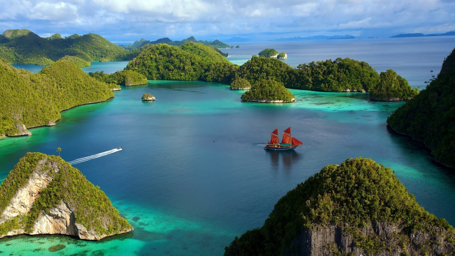 A breathtaking aerial view of a lush island landscape, featuring vibrant greenery and clear turquoise waters, with a traditional ship sailing across the serene bay.