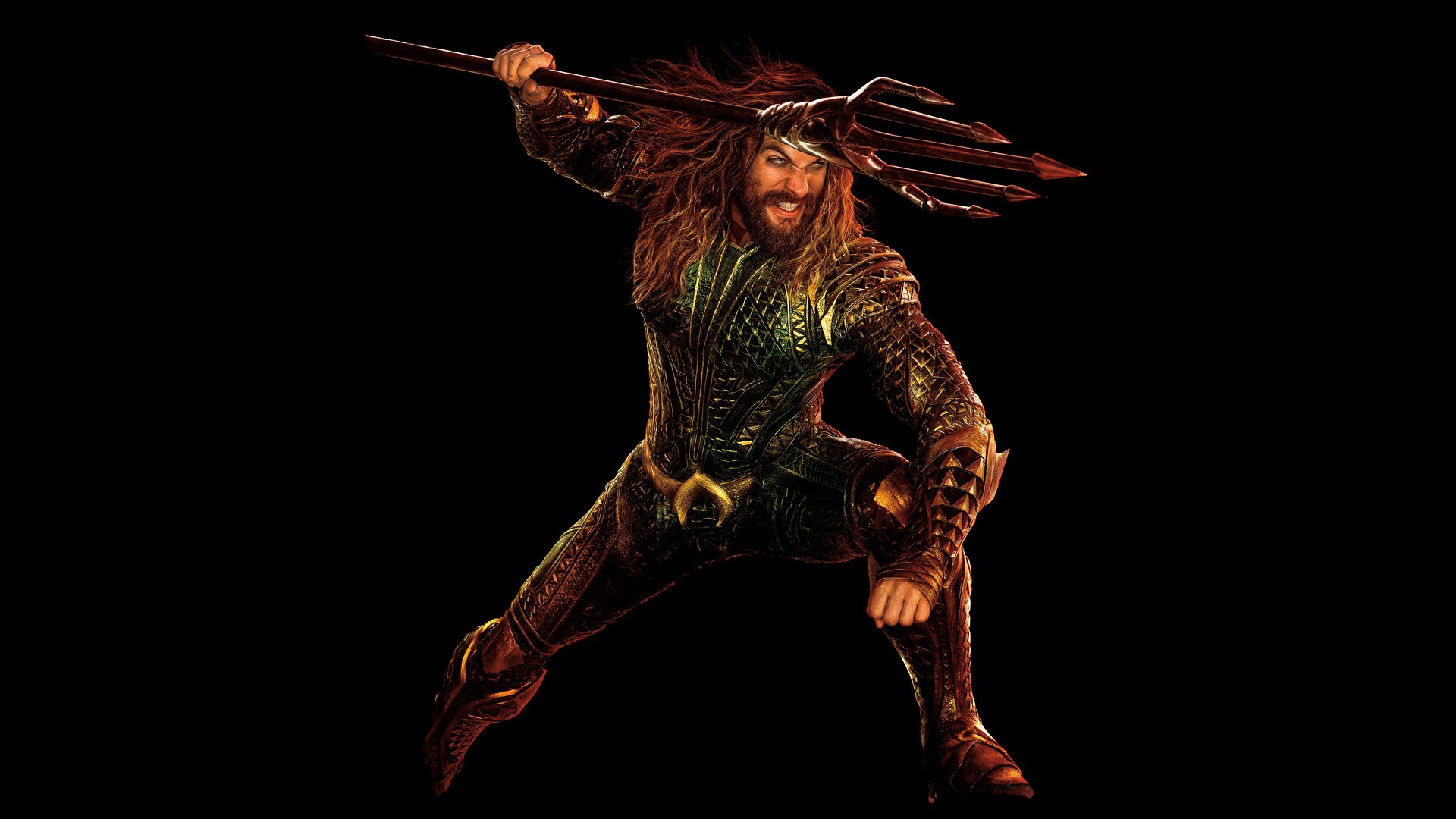 Jason Momoa as Aquaman in his iconic armored suit wielding a trident, featured in the 2017 movie Justice League.