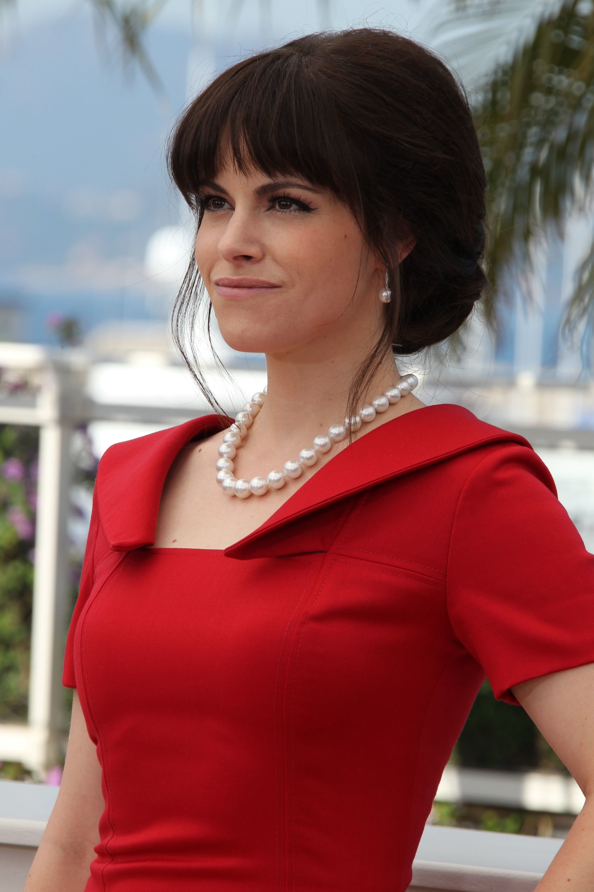 Celebrity Emily Hampshire Actress Black Hair Jewelry Pearl Image. 