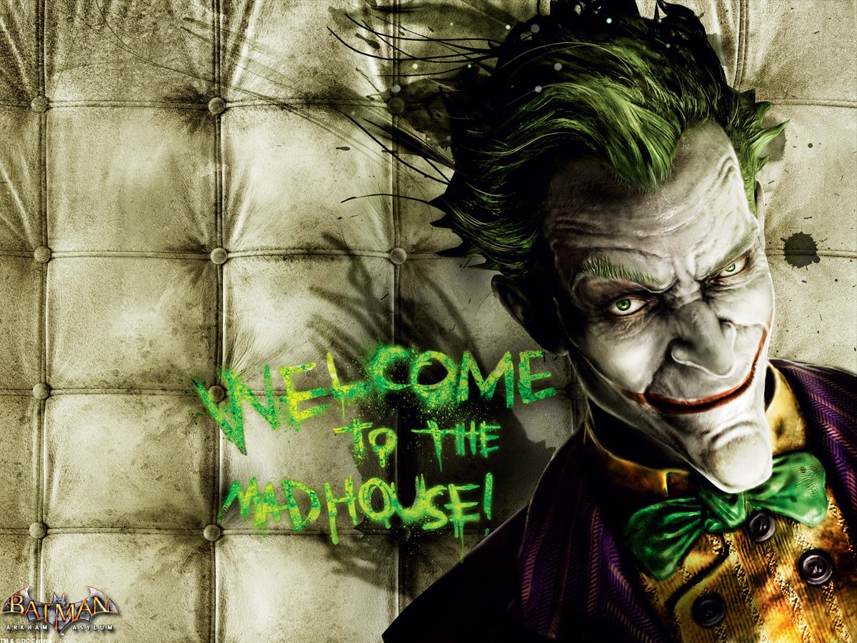 The Joker from Batman: Arkham Asylum smirks menacingly against a padded wall with Welcome to the Madhouse! graffiti in green paint.