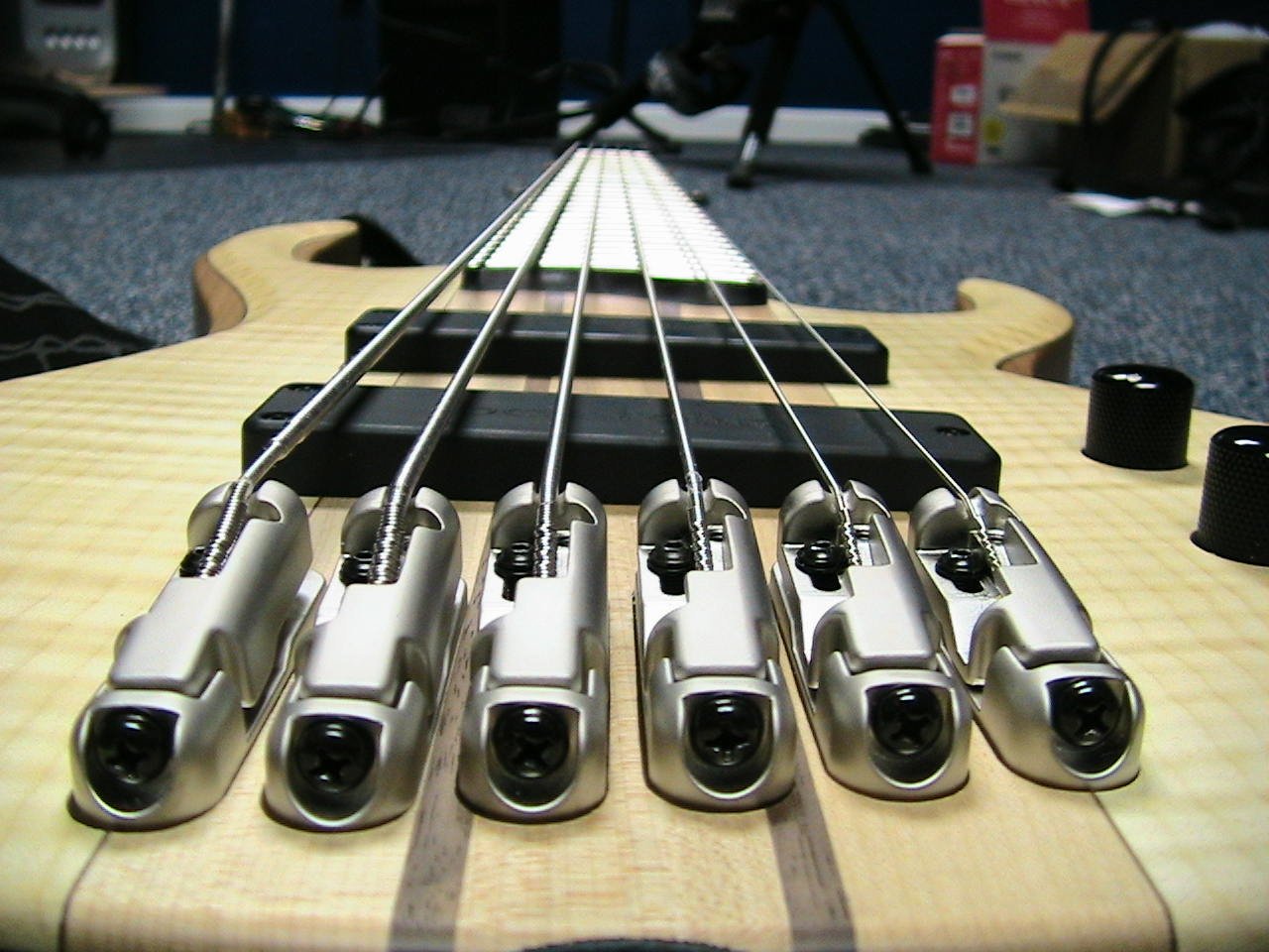 A close-up view of an electric guitar, showcasing its polished strings and hardware, capturing the essence of music and craftsmanship.