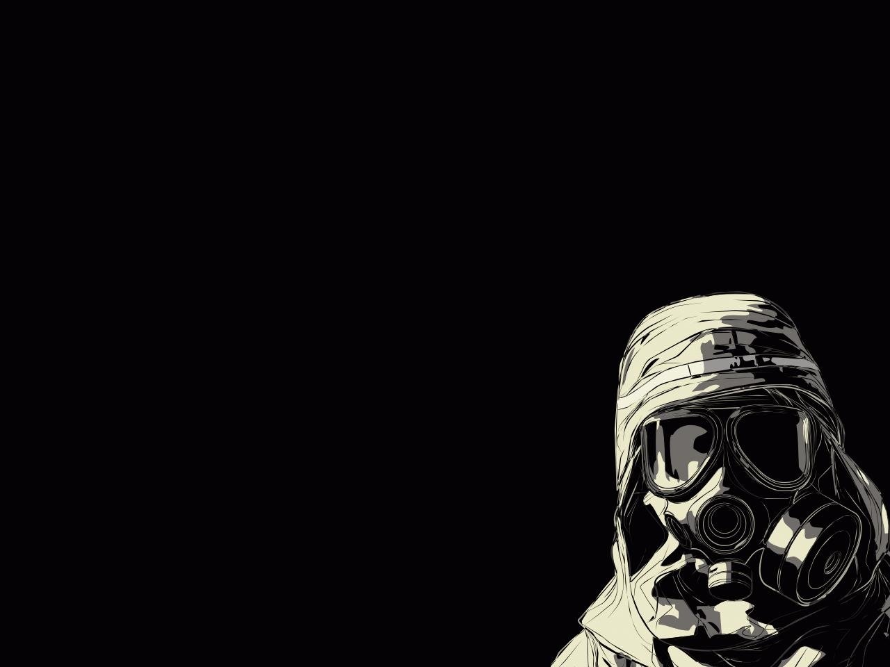 A soldier wearing a gas mask stands against a dark background, emphasizing the military's preparedness for hazardous environments. The image conveys a sense of vigilance and readiness.