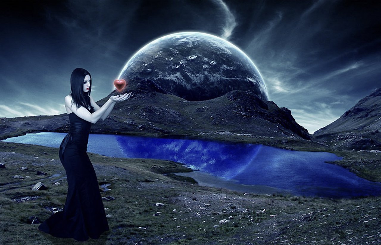 A dark-themed scene features a woman in a flowing black dress standing by a serene lake, holding a glowing red heart against a backdrop of a dramatic sky and distant planet.