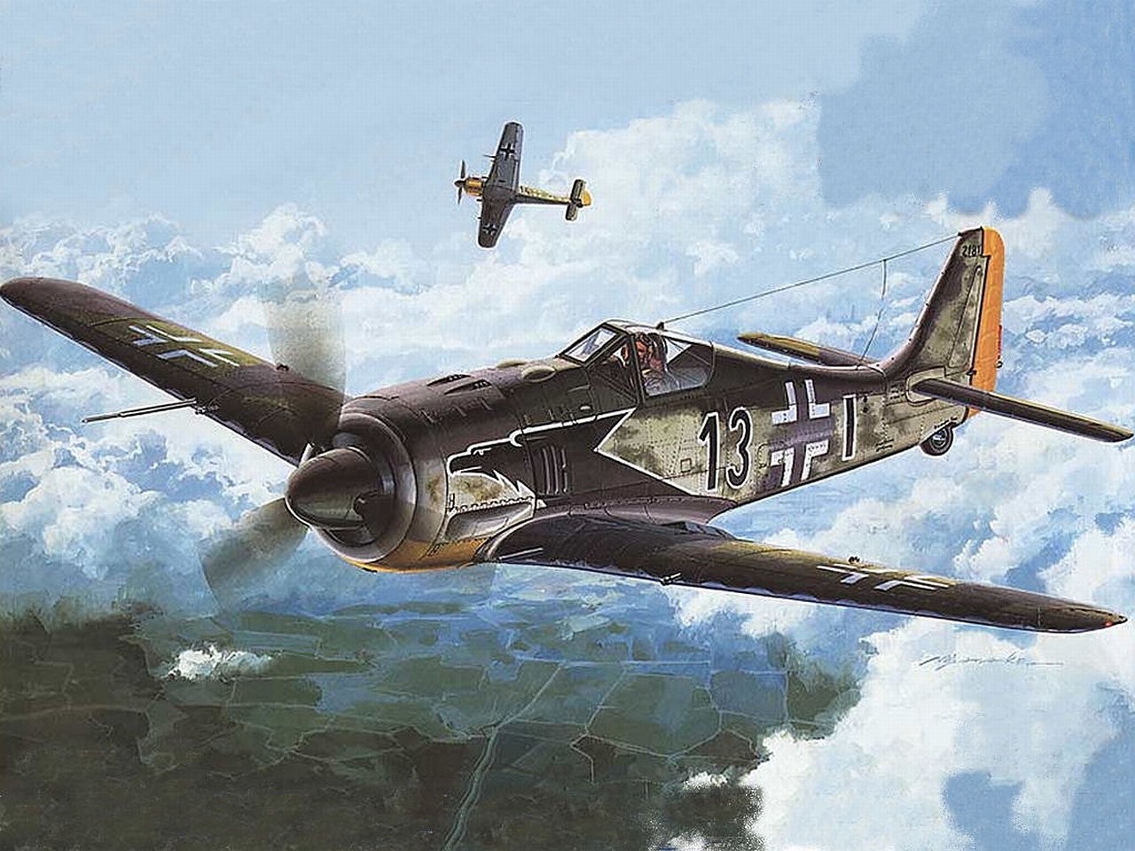 Two military aircraft fly over a landscape beneath a blue sky with scattered clouds.