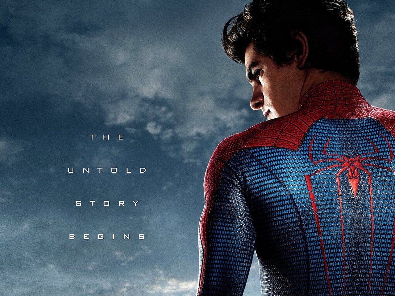 A close-up of Spider-Man's back, showcasing his iconic suit and emblem, with clouds in the background. Text reads, The Untold Story Begins, referencing the movie, The Amazing Spider-Man.