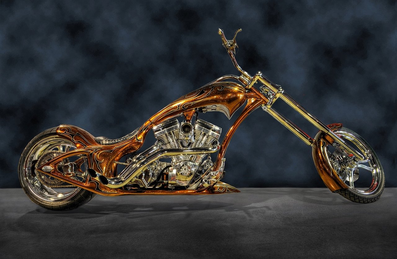 A striking motorcycle with an intricate design and metallic finish, alongside the character Tony Tony Chopper, creates a dynamic and artistic composition.
