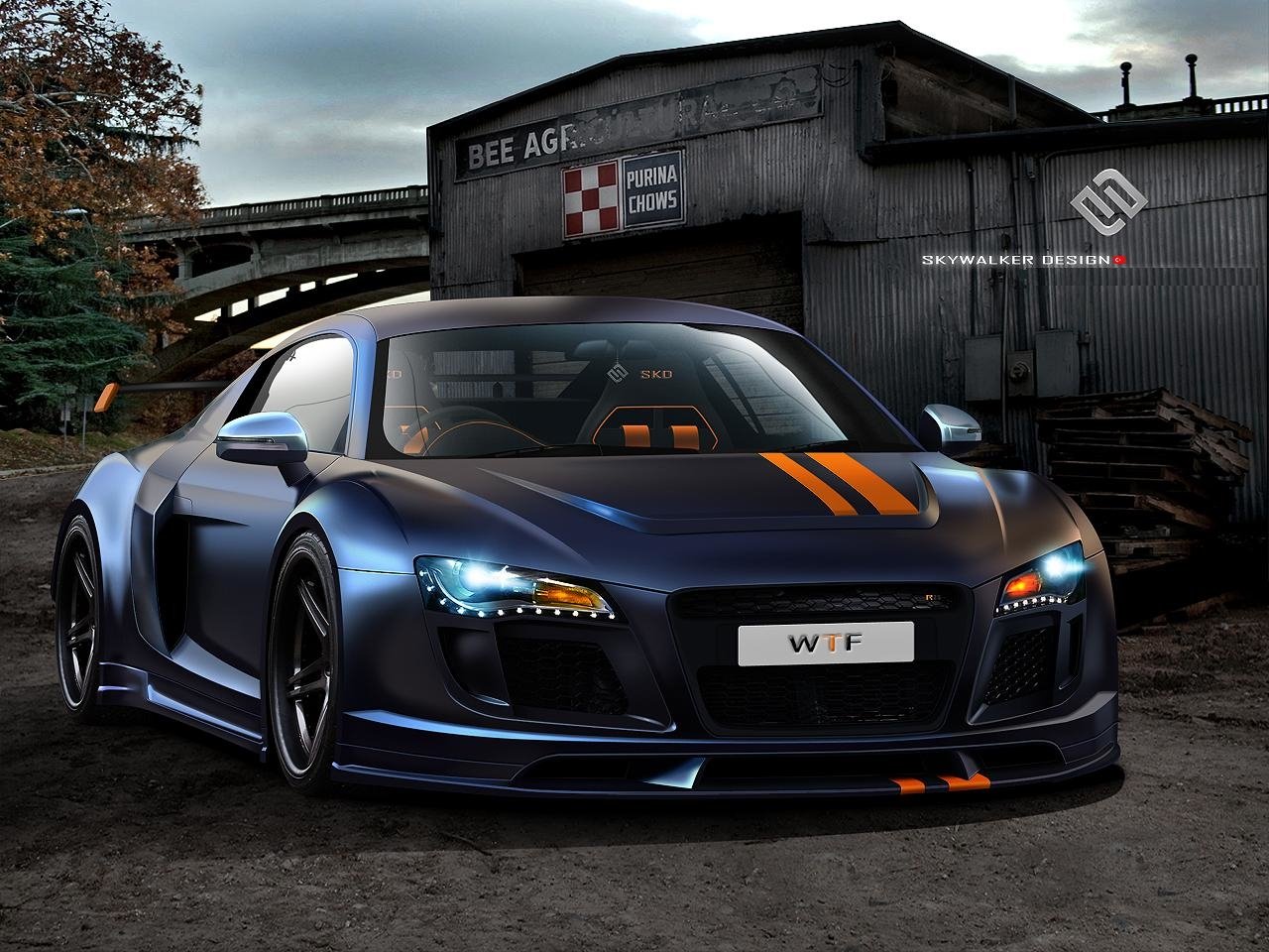 A sleek, modified Audi R8 with matte blue paint and orange racing stripes parked in front of an industrial building at dusk.