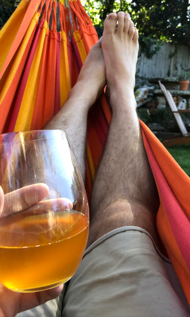 legs feet drink man made hammock Image