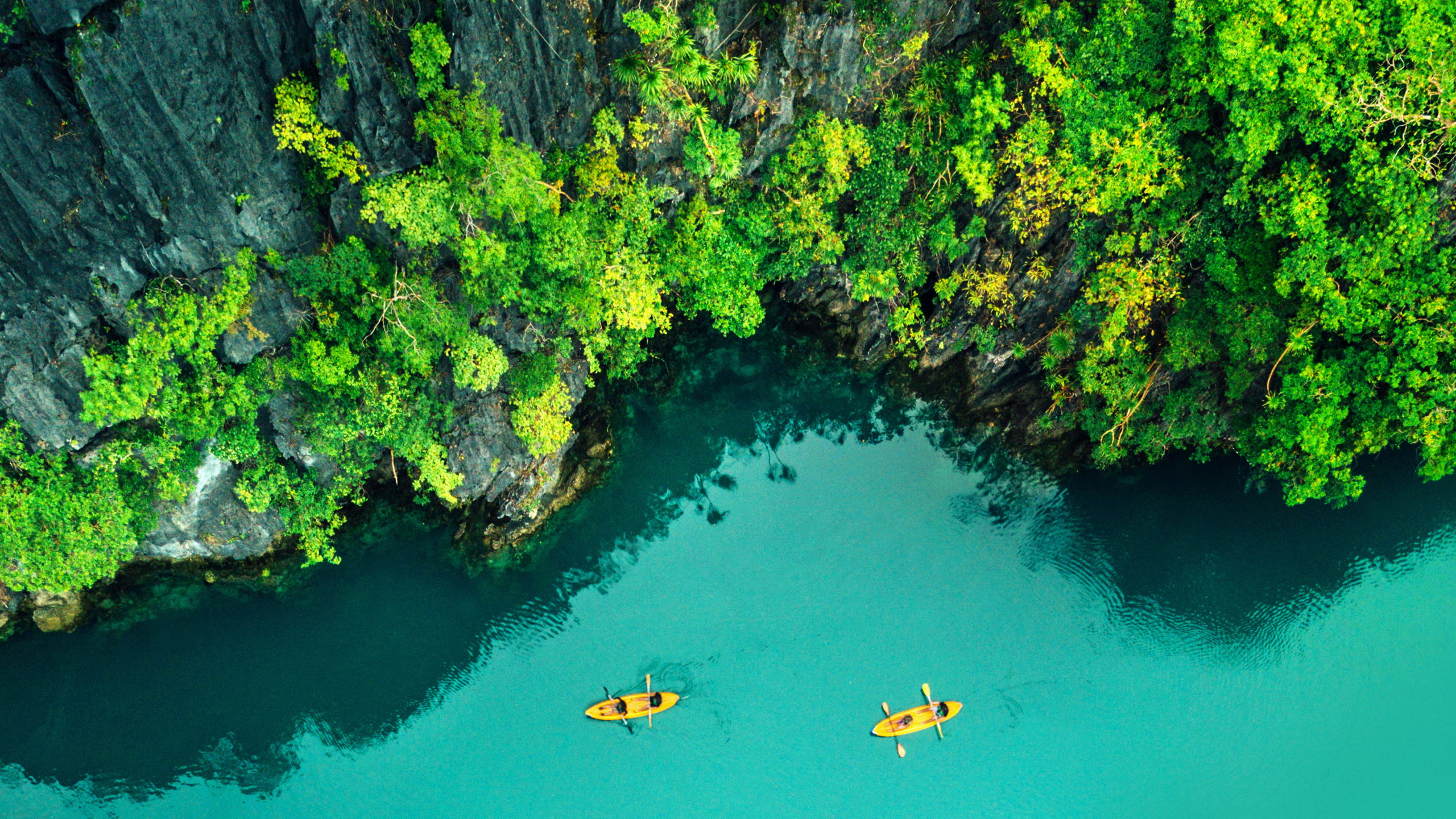 Aerial View of Two Kayakers on Tropical Sea