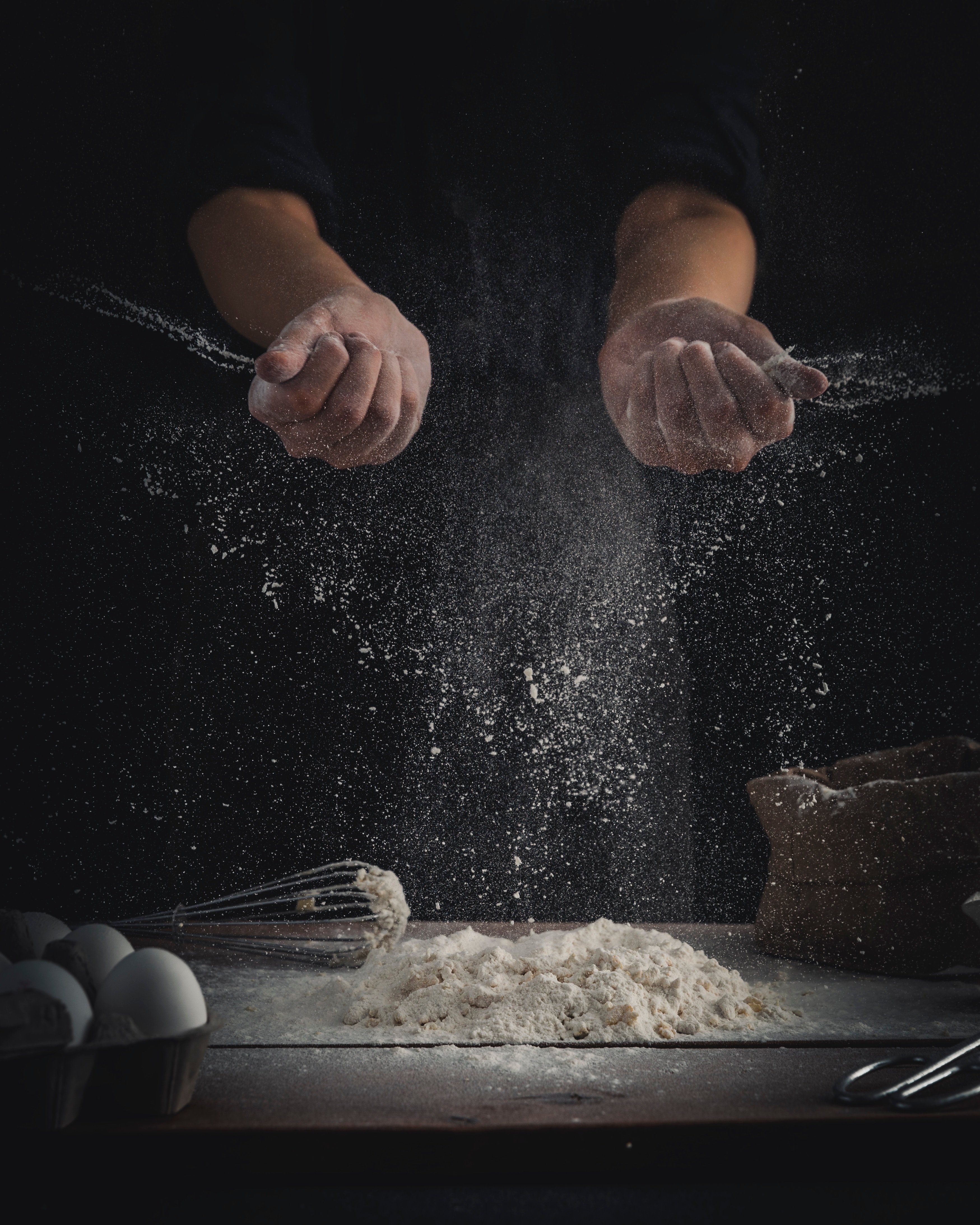 Baker with wheat flour by Mae Mu