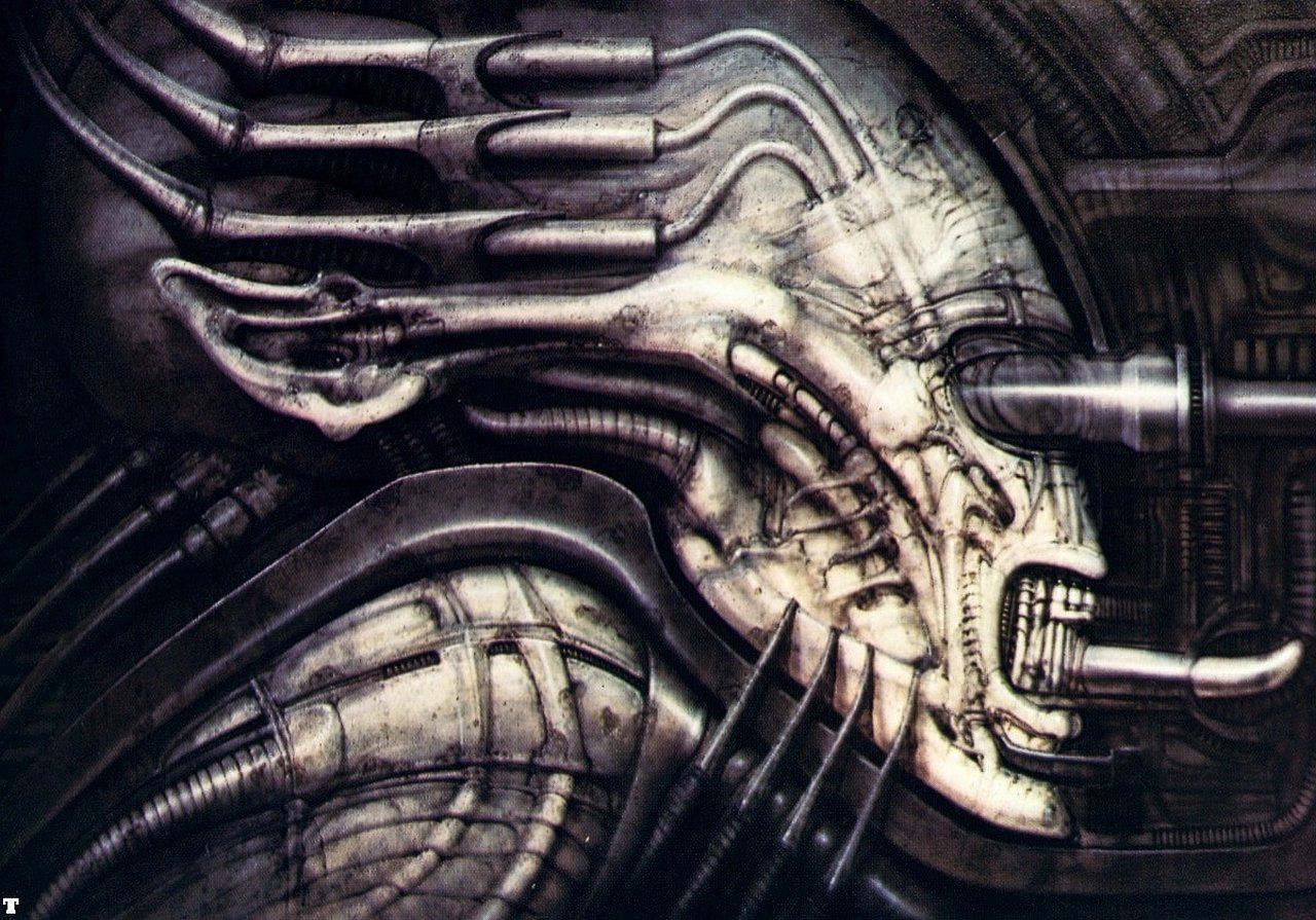 Close-up of a biomechanical alien creature from a movie, featuring intricate tubes and a skeletal, otherworldly design.
