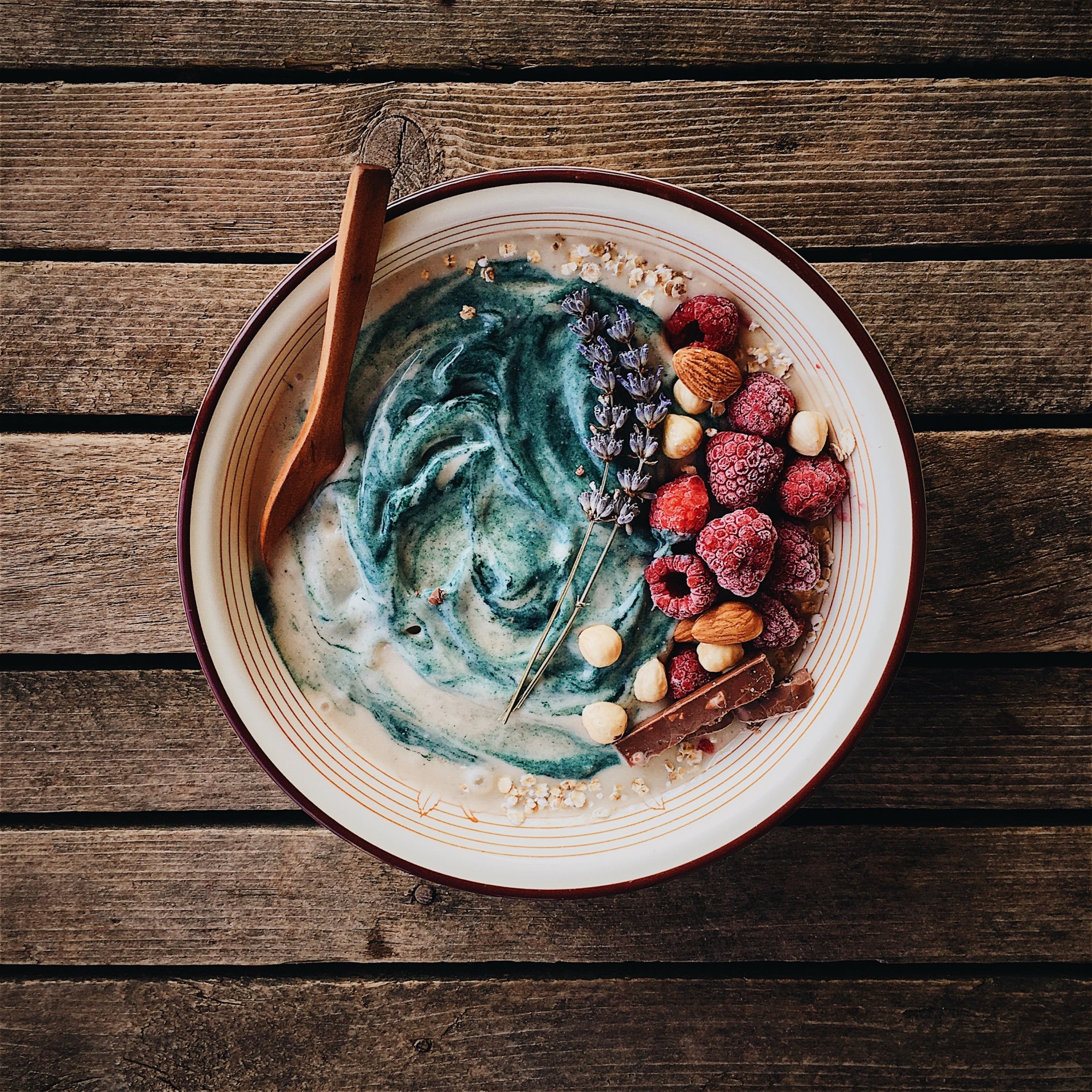 Cereals bowl with frozen raspberries and nuts by Daniel Cuklev
