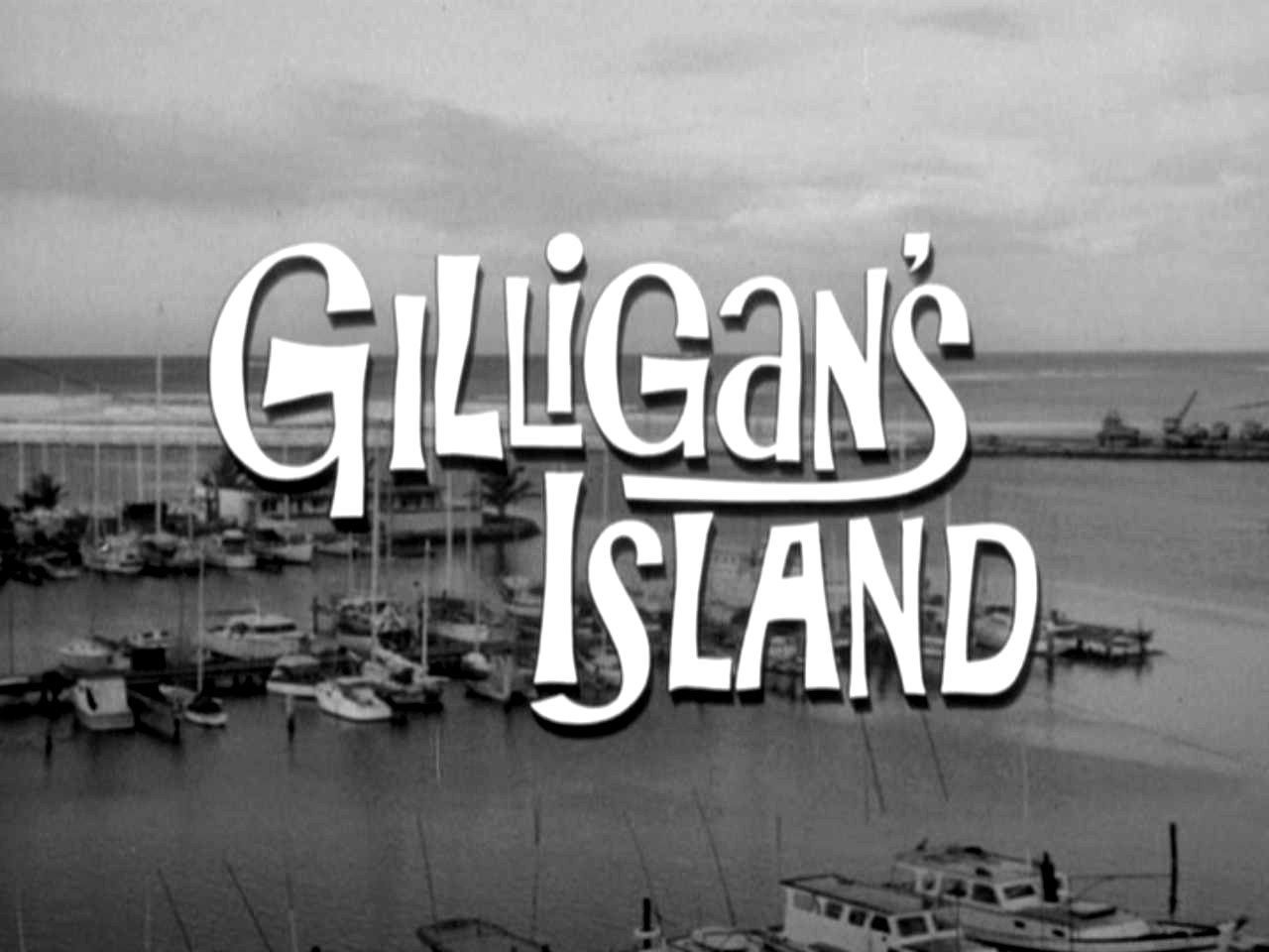 Black-and-white title screen of the TV show Gilligan's Island over a harbor filled with boats.